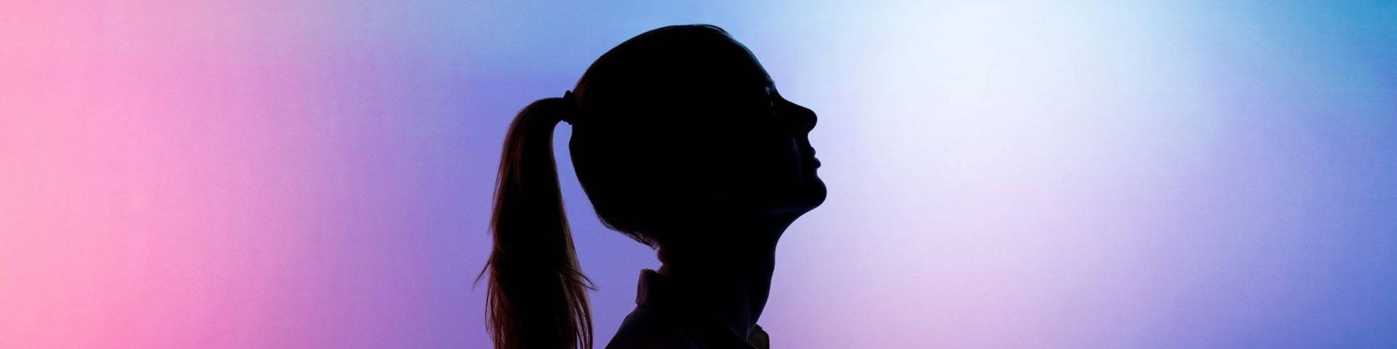 Silhouette of woman's head looking up 